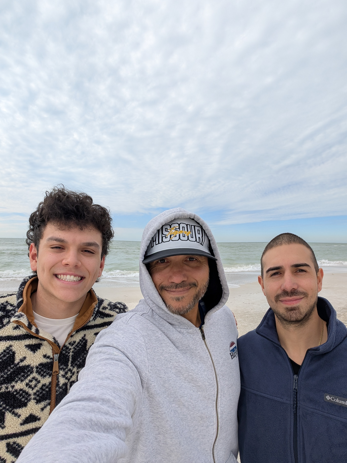 Mario with his two sons on the beach